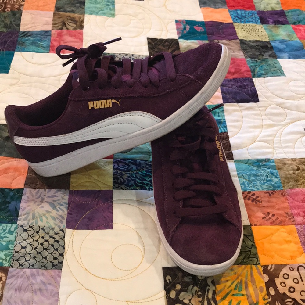 Plum colored Puma tennis shoes